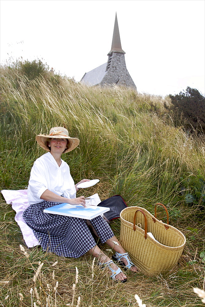 Catherine Jeanne painting the small town of Etretat and the coast, Cote d'Albatre, Seine Maritime, Normandy, France, Europe