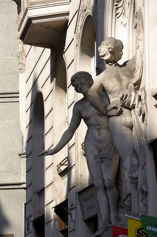 Female figure sculptures on building, Prague, Czech Republic, Europe