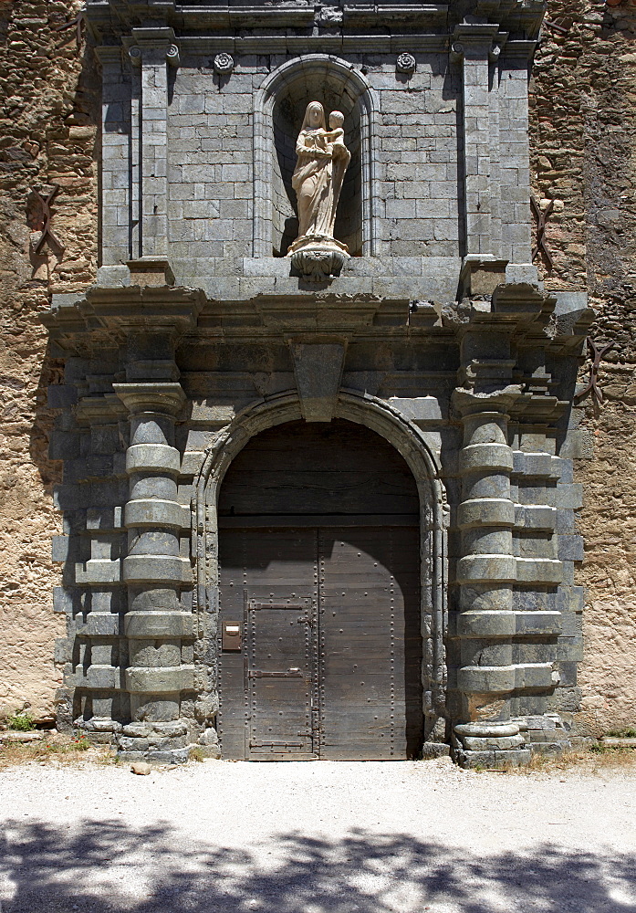 The Great Door with pilasters of serpentine stone, volcanic marble, Chartreuse de la Verne, Provence, France, Europe