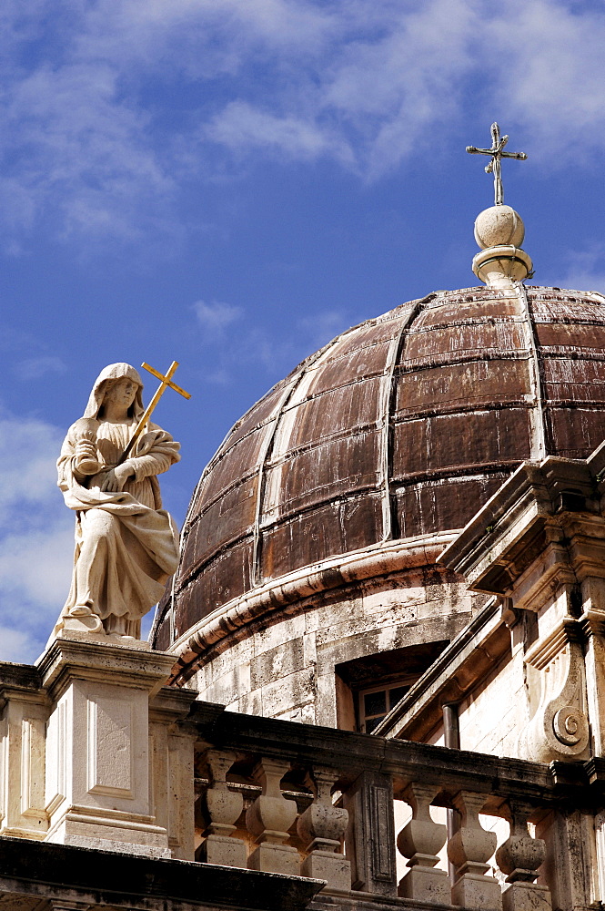 Close up of the dome of St. Blaise Church, with a statue and elaborate stone work, Dubrovnik, Croatia, Europe