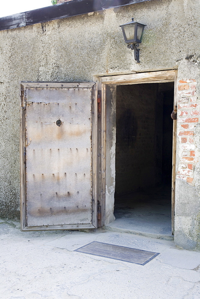 The wooden entrance door into the Gas Chambers at Auschwitz Concentration Camp, Poland, Europe