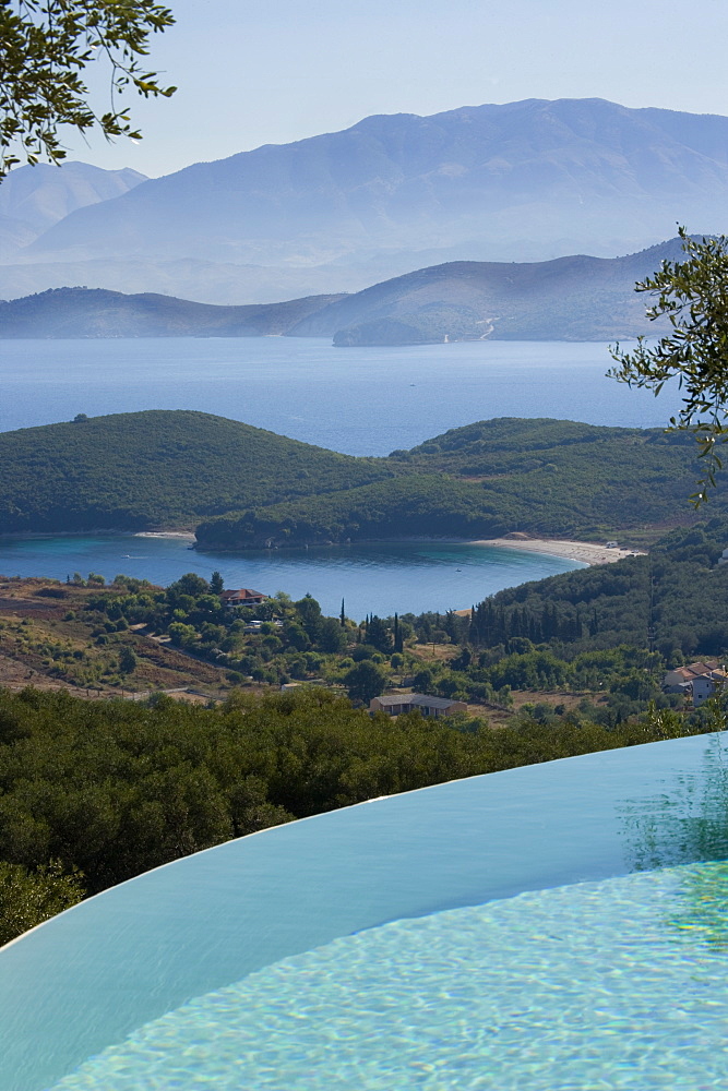 Vew across infinity pool to the Ionian Sea and Albanian Mountains, Kerkyra, Corfu, Ionian Islands, Greek Islands, Greece, Europe