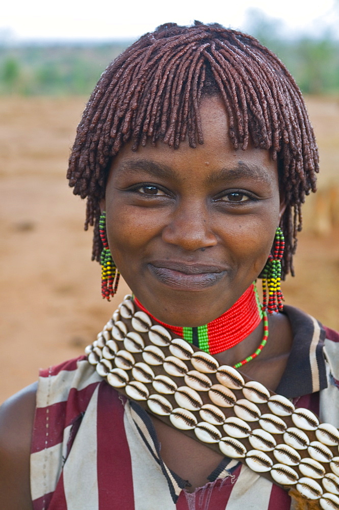 Friendly young Hamer woman, Jumping of the Bull ceremony, Omo Valley, Ethiopia, Africa