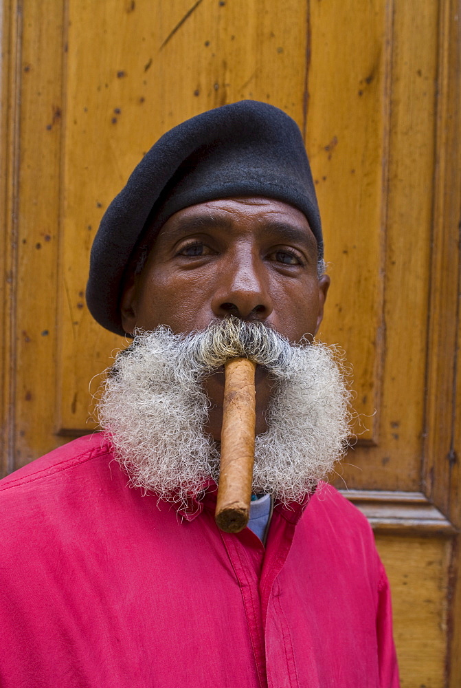 Revolutionary man smoking a cigar, Havana, Cuba, West Indies, Caribbean, Central America