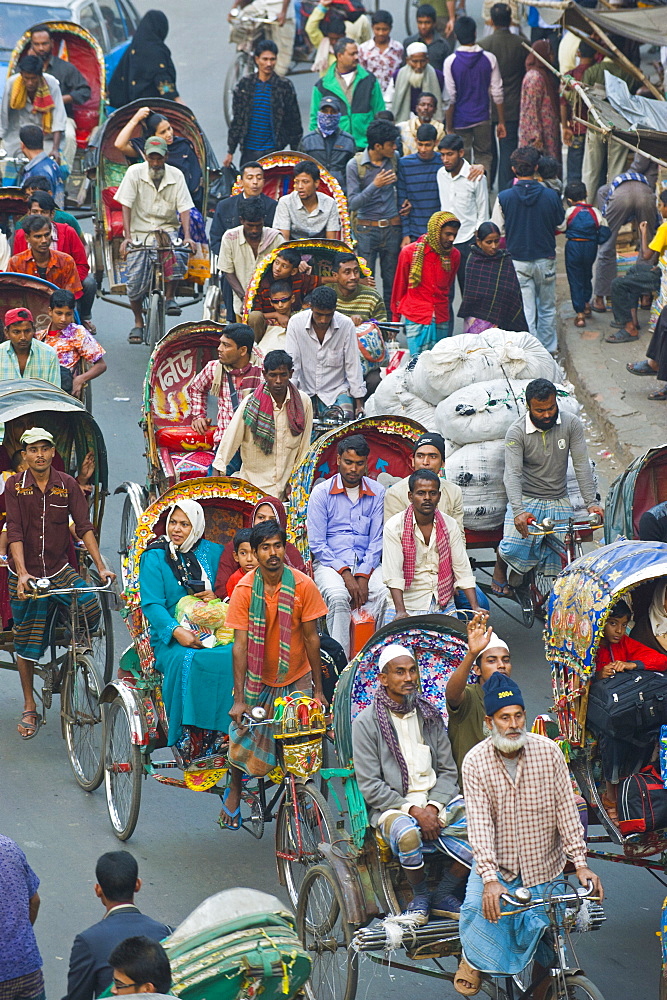 Busy rickshaw traffic on a street crossing in Dhaka, Bangladesh, Asia