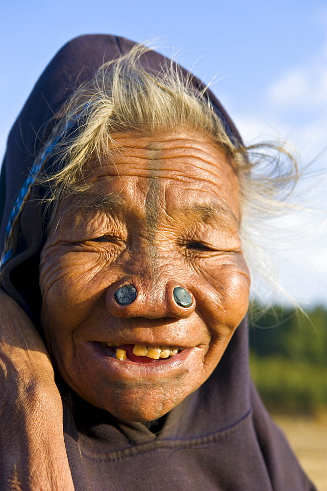 Old woman of the Apatani tribe famous for the wooden pieces in their nose to make them ugly, Ziro, Arunachal Pradesh, Northeast India, India, Asia