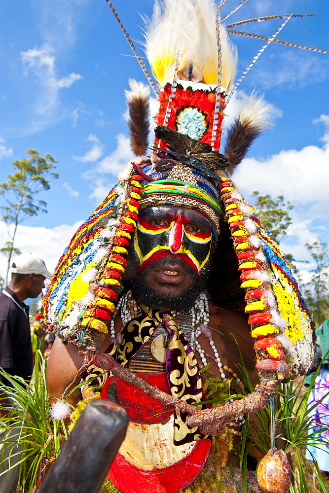 Colourfully dressed and face painted local tribesman celebrating the traditional Sing Sing in the Highlands, Papua New Guinea, Pacific