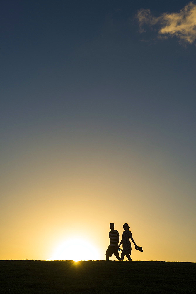 Tourists in backlight walking to the Castle of San Felipe del Morro, San Juan, Puerto Rico, West Indies, Caribbean, Central America