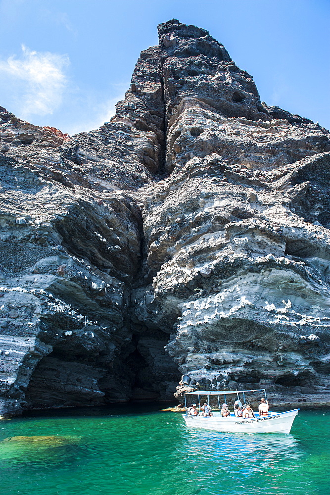 Tourist boat in front of a sea cave at Isla Espiritu Santo, Baja California, Mexico, North America