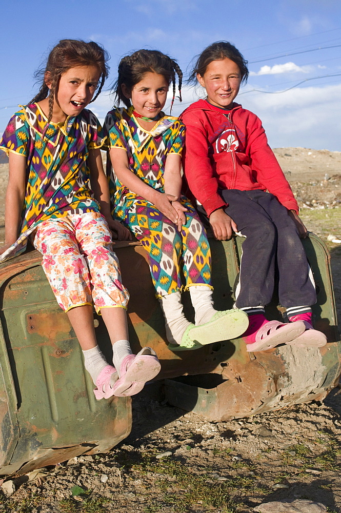 Three smiling girls posing for the camera, Murgab, Tajikistan, Central Asia, Asia