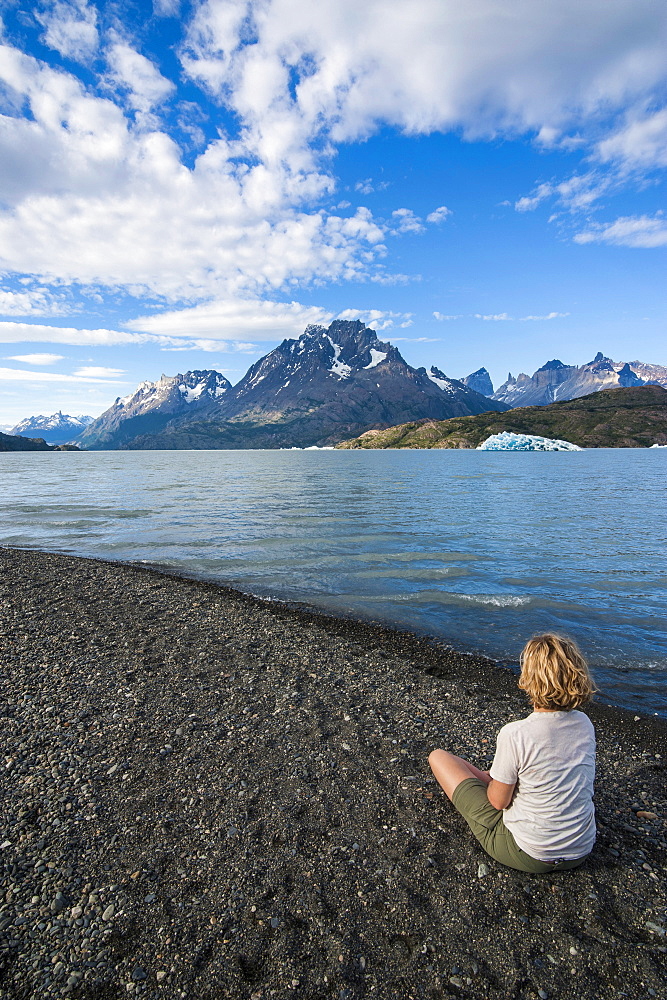 Woman enjoying Lago Grey lake in the Torres del Paine National Park, Patagonia, Chile, South America