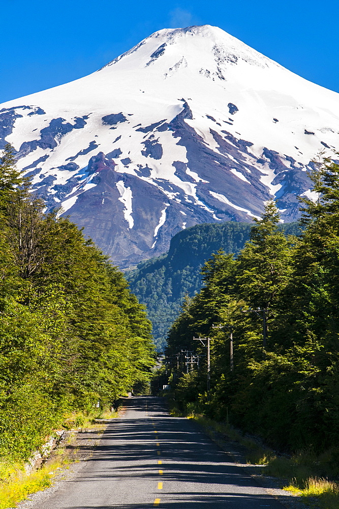 Snowcapped volcano Villarrica towering above Pucon, southern Chile, South America 