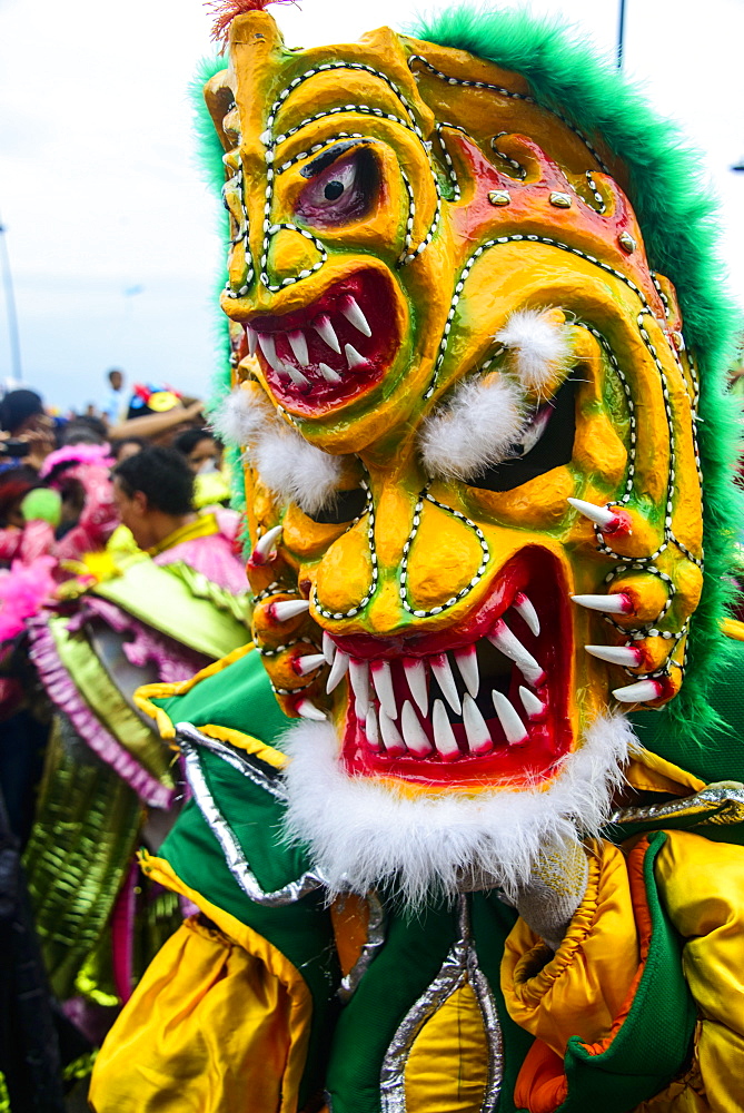 Colourful dressed masked man in the Carneval (Carnival) in Santo Domingo, Dominican Republic, West Indies, Caribbean, Central America