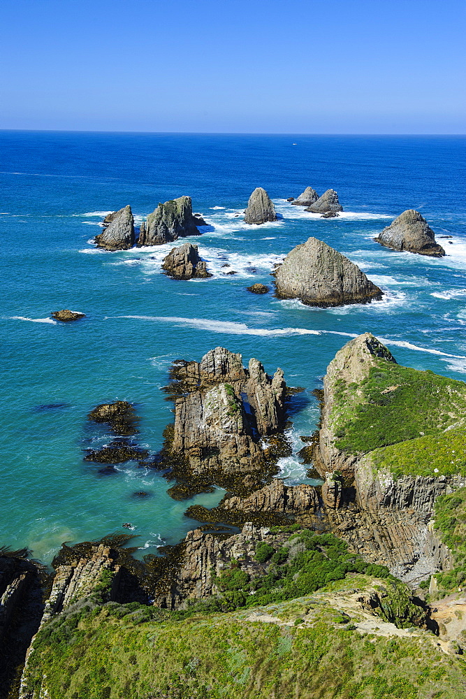 View from the Nugget Point Lighthouse in the turquoise waters with huge rocks, the Catlins, South Island, New Zealand, Pacific