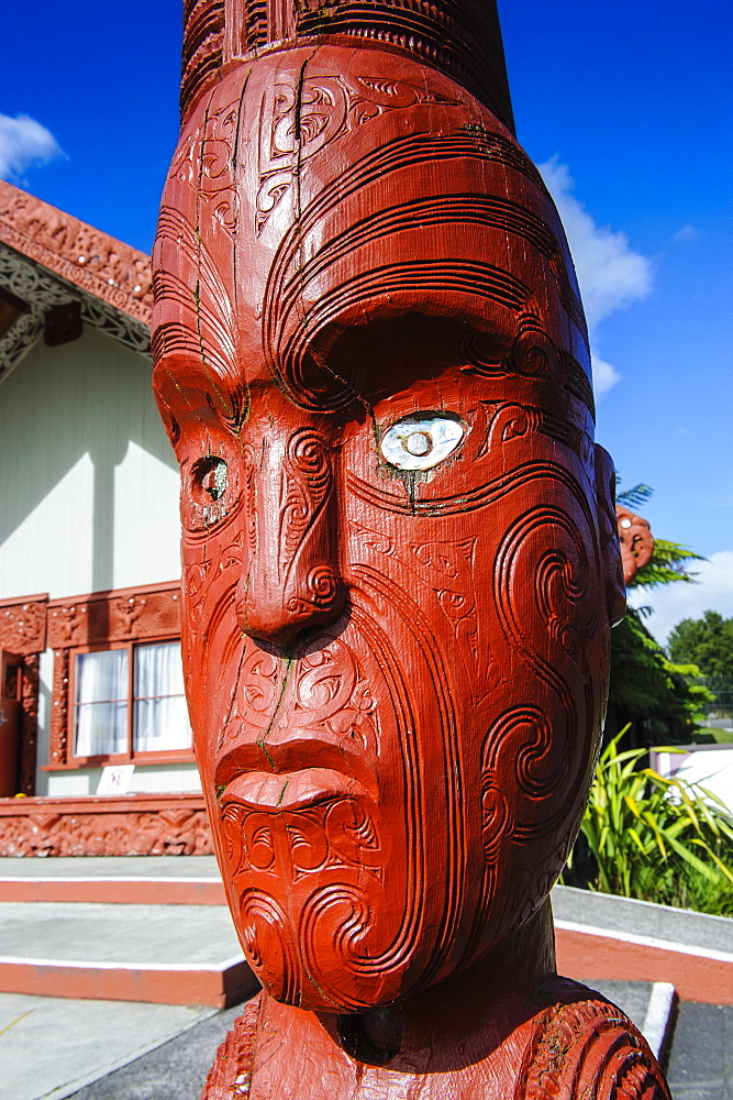 Traditional wood carved mask in the Te Puia Maori Cultural Center, Rotorura, North Island, New Zealand, Pacific