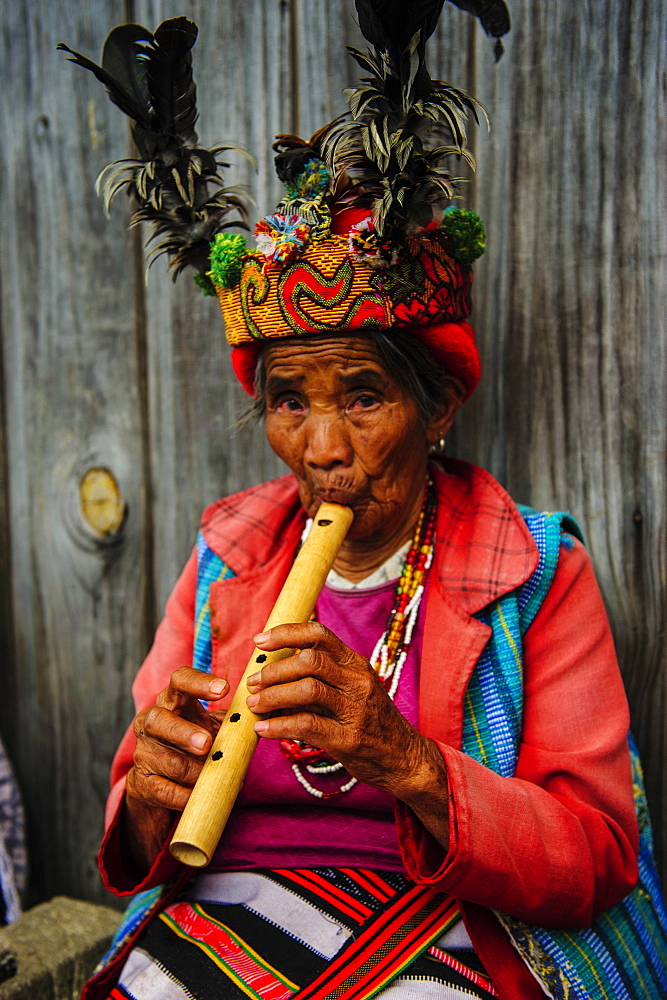 Traditional dressed Ifugao women playing the flute in Banaue, UNESCO World Heritage Site, Northern Luzon, Philippines, Southeast Asia, Asia