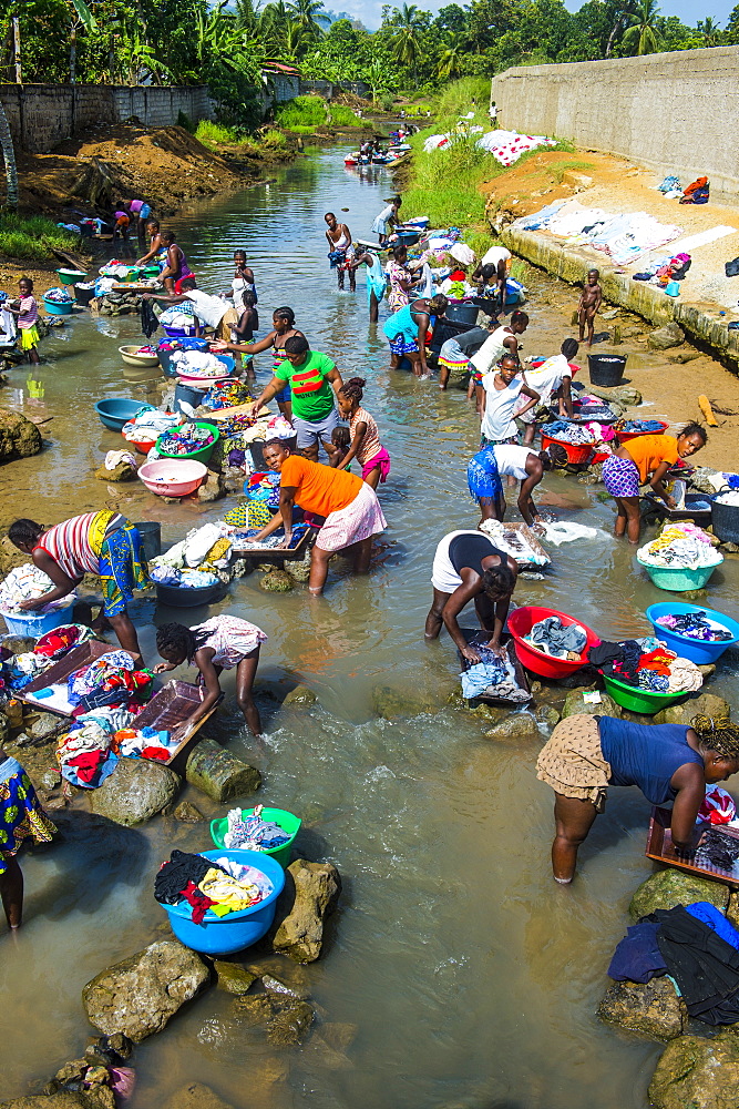 Women washing clothes in a river bed, City of Sao Tome, Sao Tome and Principe, Atlantic Ocean, Africa