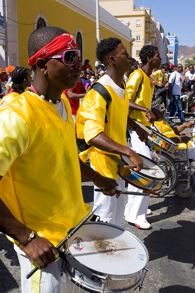 Costumed people celebrating Carnival while playing the drums, Mindelo, Sao Vicente, Cape Verde, Africa