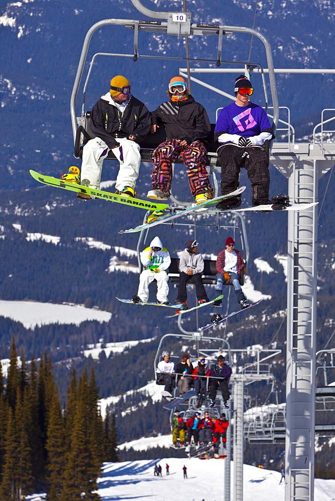 Chairlift carrying skiers and snowboarders, Whistler Mountain, Whistler Blackcomb Ski Resort, Whistler, British Columbia, Canada, North America