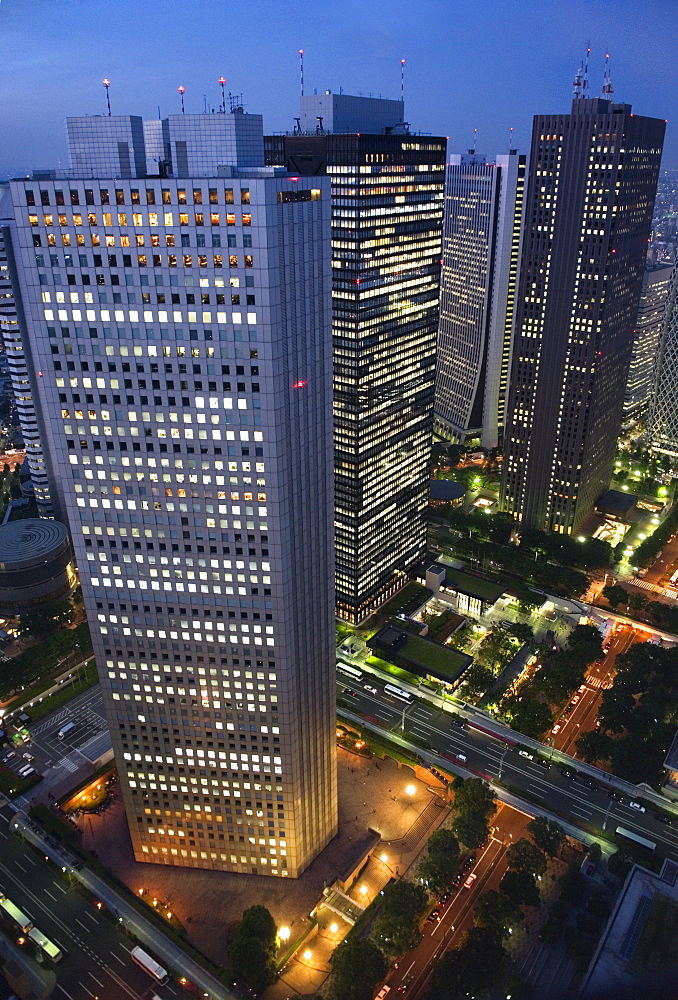 Evening skyline view of skyscraper corporate buildings in Nishi Shinjuku (West Shinjuku), Tokyo, Japan, Asia