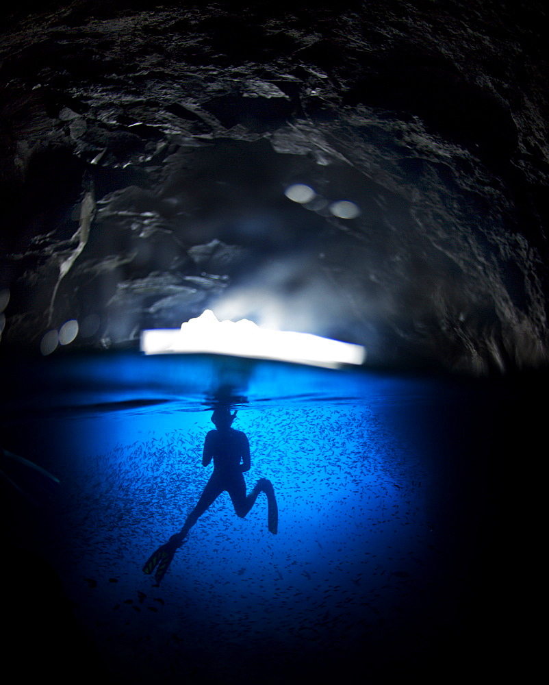 Free diving in a cave off Espanola Island, Galapagos, South America