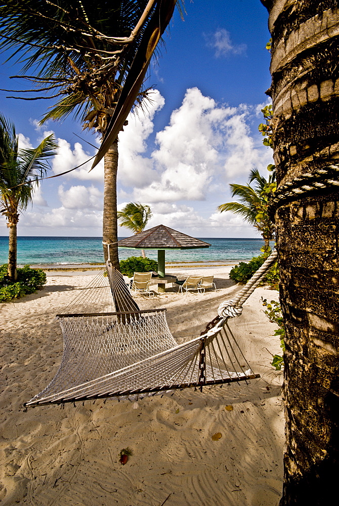 A hammock on an empty beach, Antigua, Leeward Islands, West Indies, Caribbean, Central America