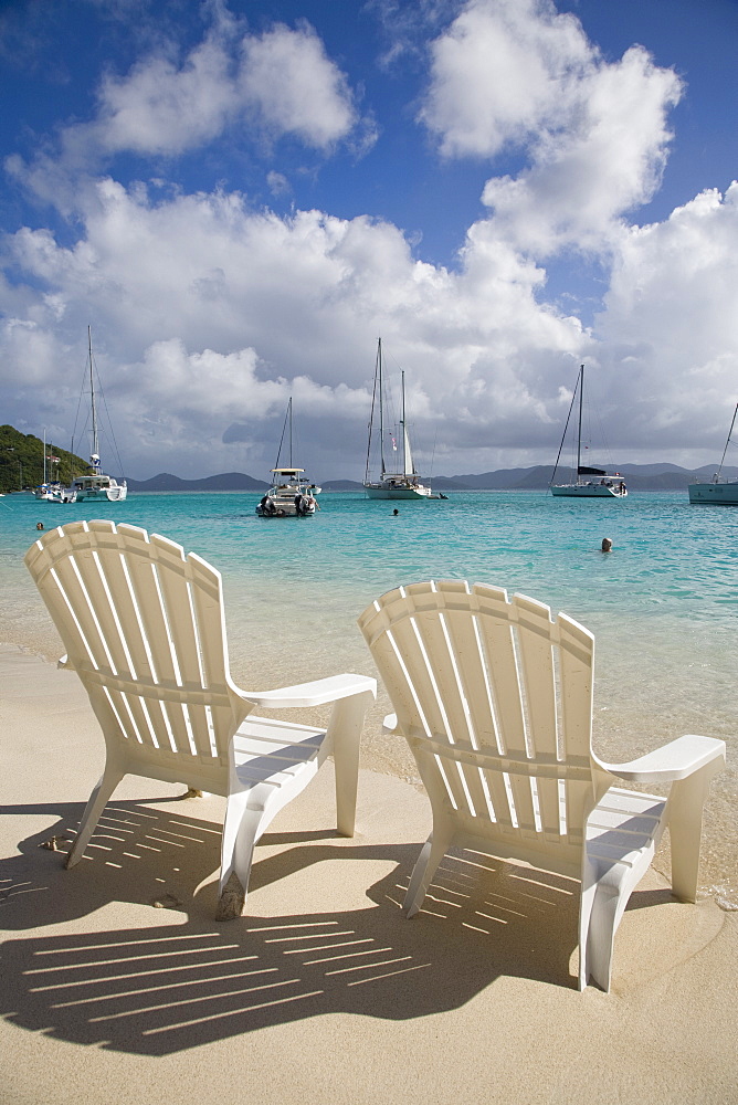 Two empty beach chairs on sandy beach on the island of Jost Van Dyck in the British Virgin Islands, West Indies, Caribbean, Central America