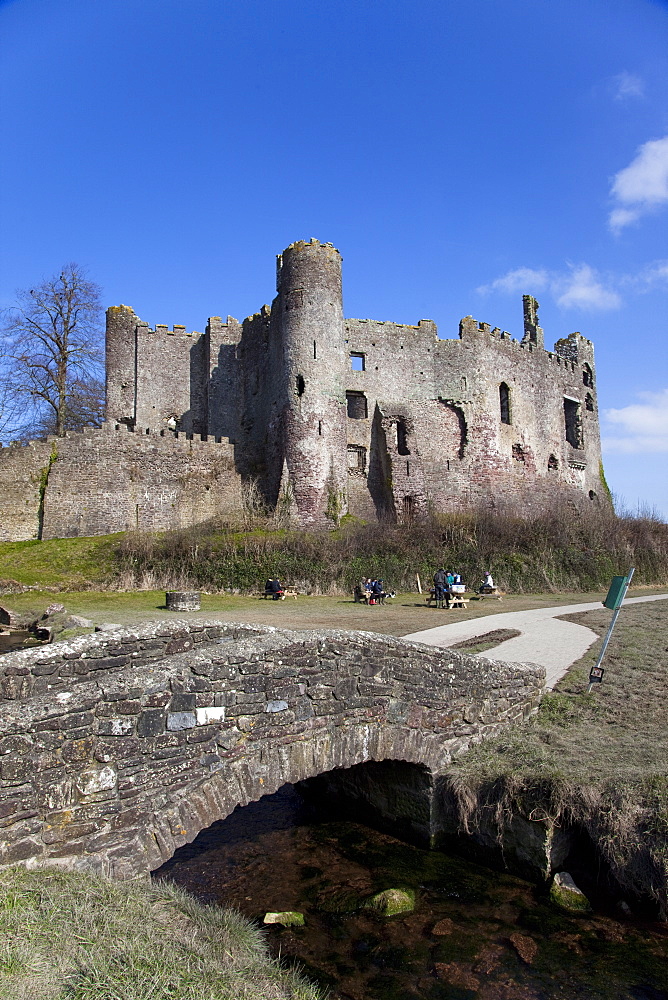 Stone footbridge in front of Laugharne Castle, Carmarthenshire, Wales, United Kingdom, Europe