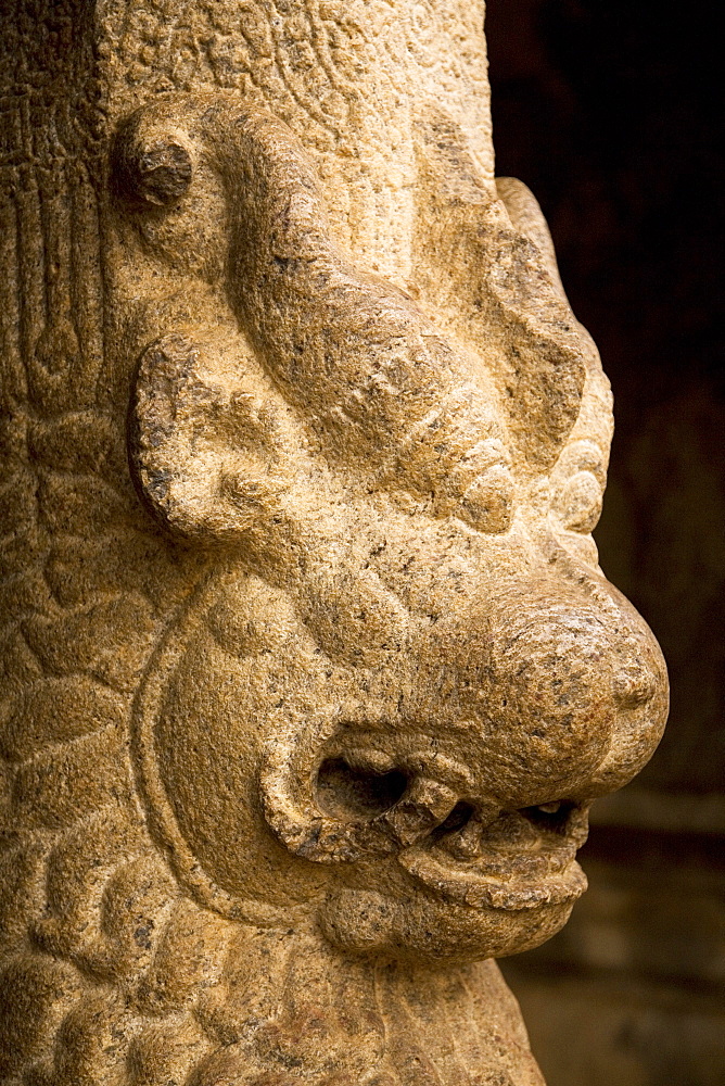 Detail from a pillar of one of the mandapams (or mandapas), rock-cut cave temples within the ancient site of Mahabalipuram (Mamallapuram), UNESCO World Heritage Site, Tamil Nadu, India, Asia