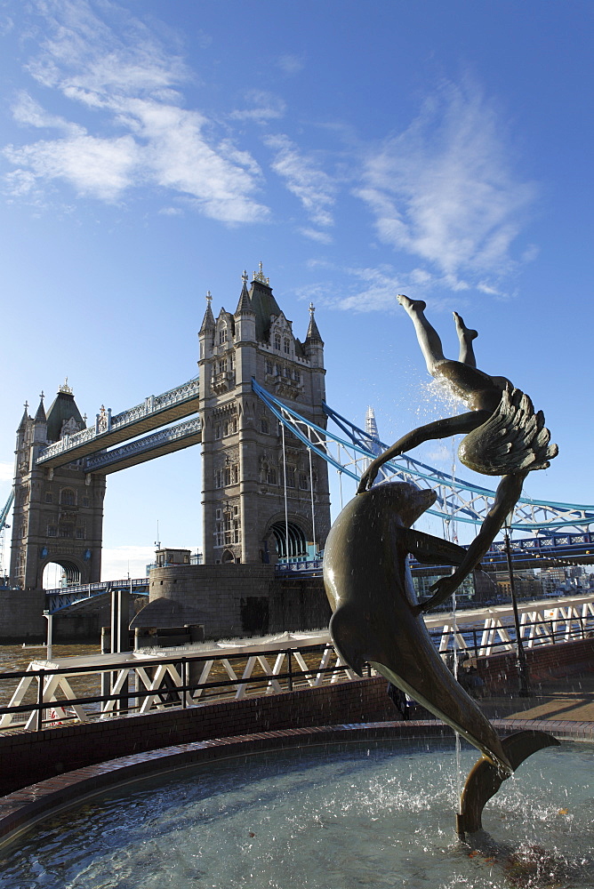 Tower Bridge and the Girl with Dolphin statue by David Wynne, by the River Thames, London, England, United Kingdom, Europe