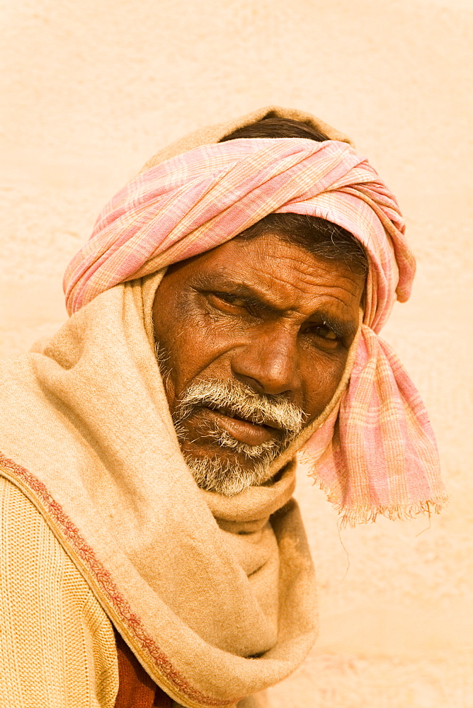 An Indian man is wrapped in a shawl in Varanasi, Uttar Pradesh, India, Asia