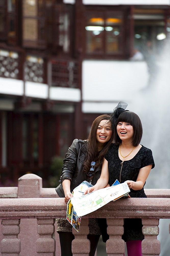 Tourists with a map at Yu Yuan Garden, Huangpu District, Shanghai, China, Asia