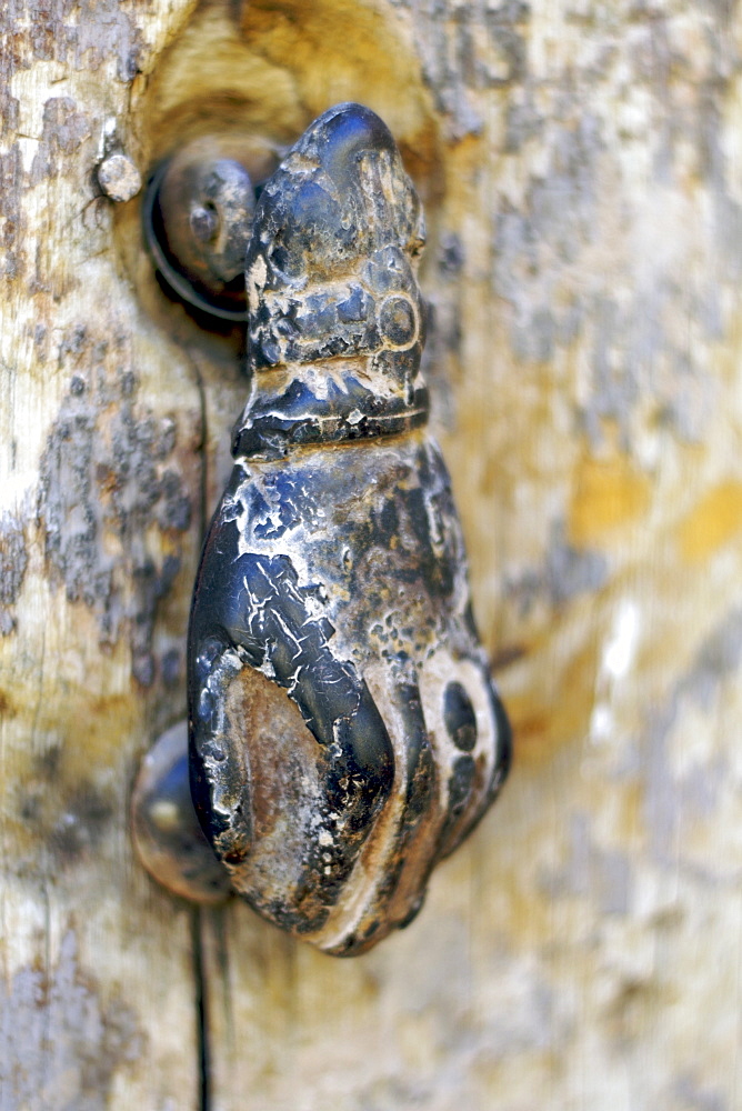 A 'hand of Fatima' door knocker on a door in the kasbah of Ait Ben Haddou near Ouarzazate in Morocco