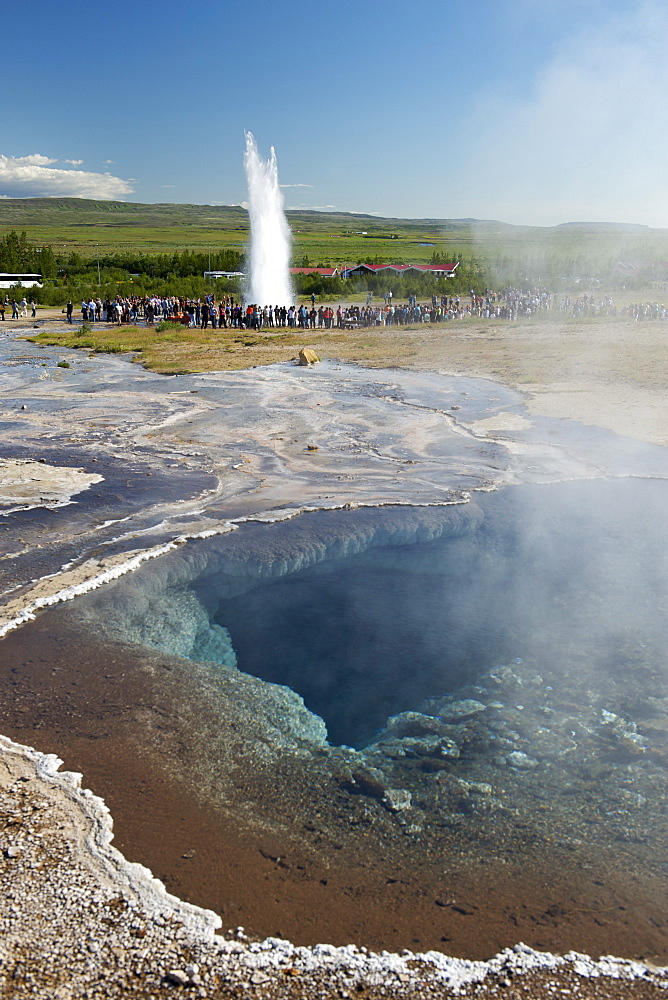 Thermal pools at Geysir with Strokkur geyser erupting in the background, Geysir, southwest area, Iceland, Polar Regions