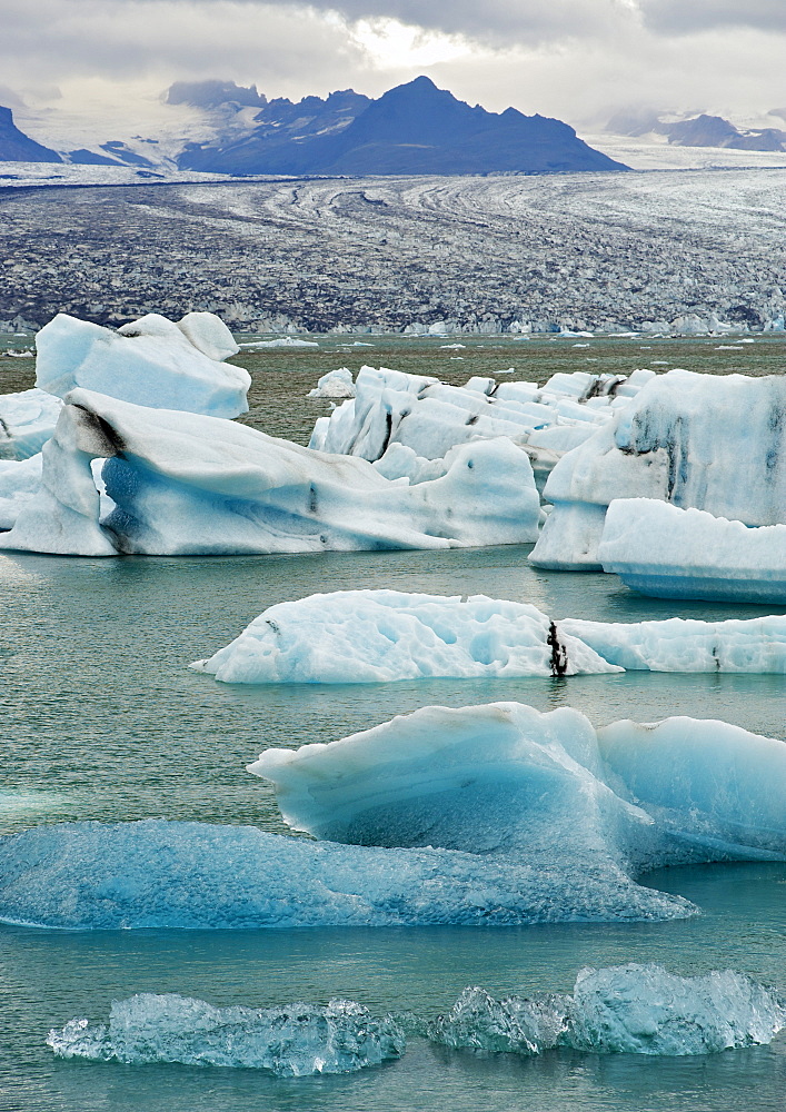 Icebergs floating in the Jokullsarlon lake at the foot of the massive Vatnajokull glacier, in the southeast, Iceland, Polar Regions