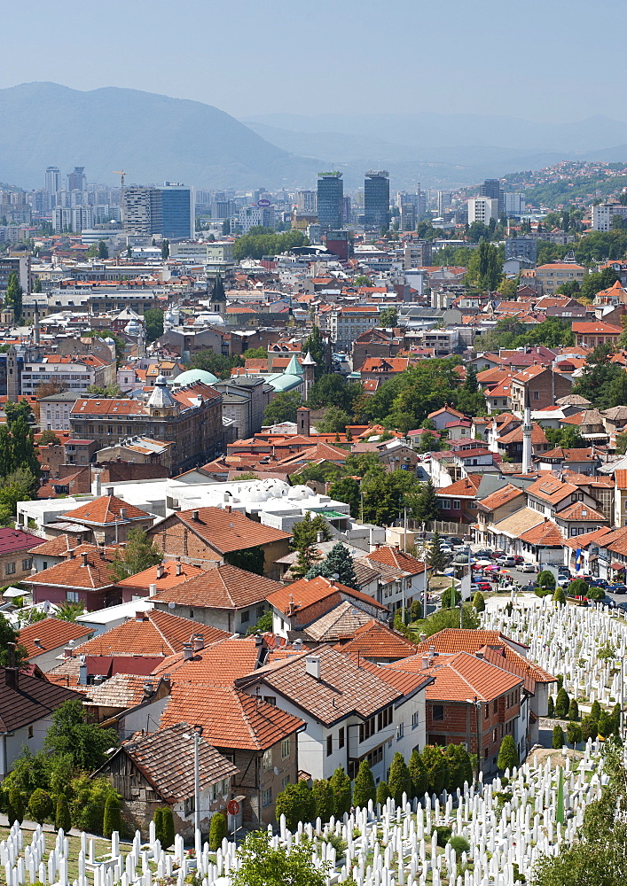 View across the Martyrs Memorial Cemetery in the foreground, of Sarajevo, capital of Bosnia and Herzegovina, Europe