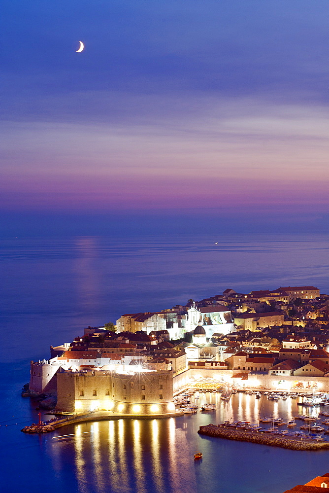 Dusk view of the old harbour port and old town, Dubrovnik, UNESCO  World Heritage Site, Adriatic Coast, Croatia, Europe