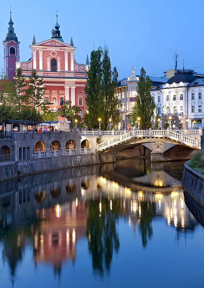 The Franciscan Church of the Annunciation and the Triple Bridge over the Ljubljanica River in Ljubljana, Slovenia, Europe