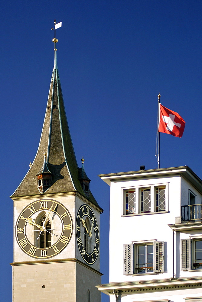 The clock tower and steeple of St Peter's church in Zürich Switzerland. It has the largest clock face in Europe (8.7m).