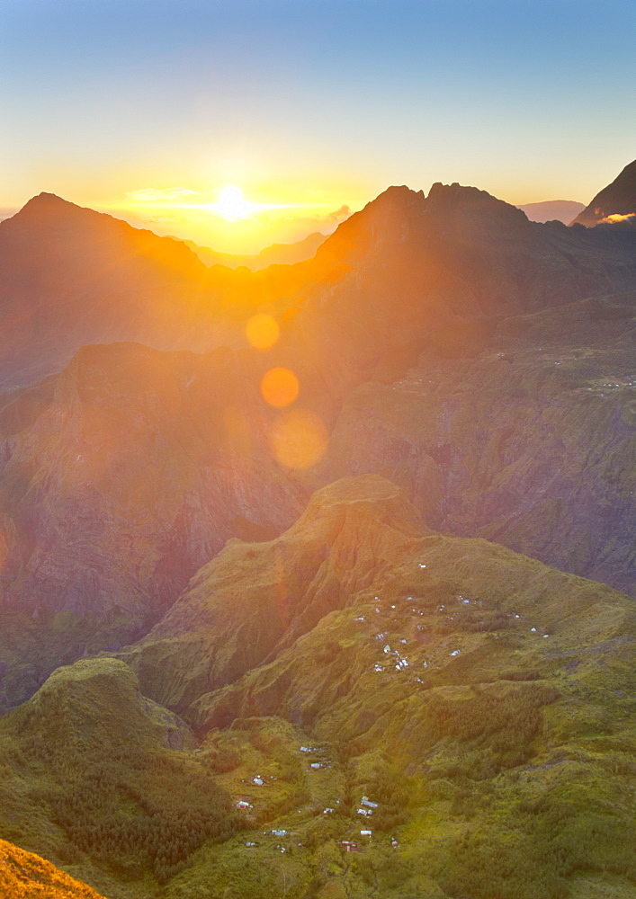 The sun rising over the Cirque de Mafate caldera on the French island of Reunion in the Indian Ocean, Africa