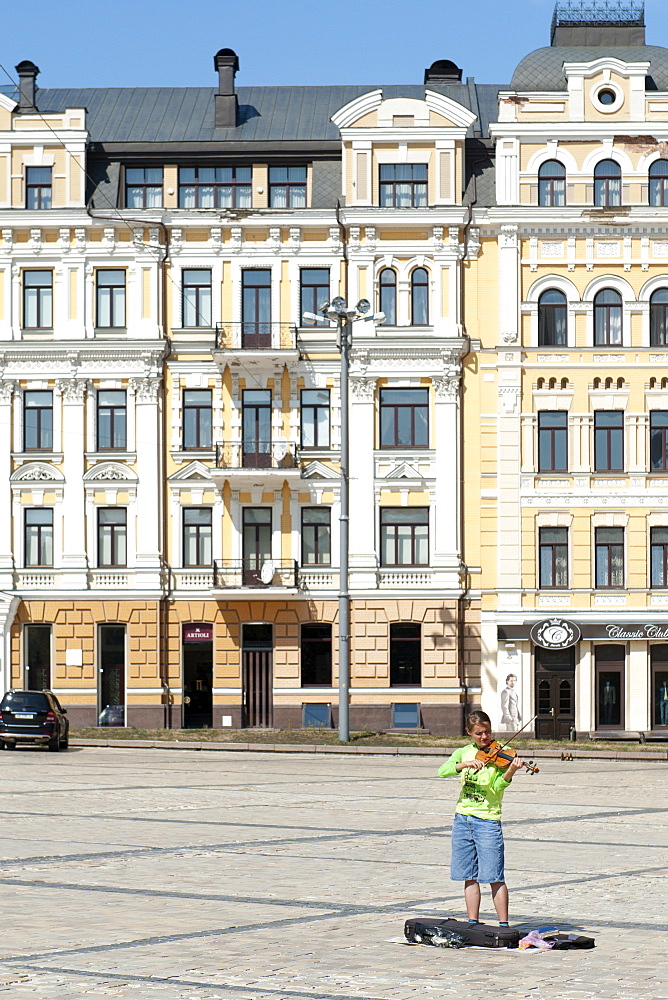 Busker playing a violin in St. Sophia's Square in Kiev, the capital of Ukraine, Europe