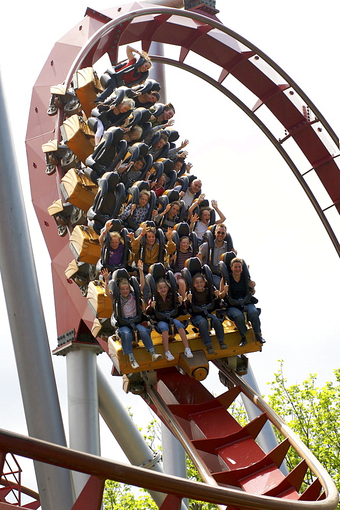 People riding a roller-coaster, Tivoli Gardens Amusement Park, Copenhagen, Denmark, Scandinavia, Europe