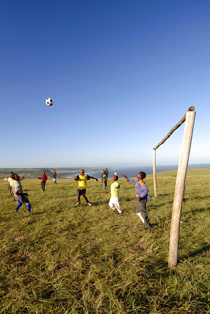 Young Xhosa boys playing football on the hills near Mazeppa Bay in the Eastern Cape Province of South Africa.