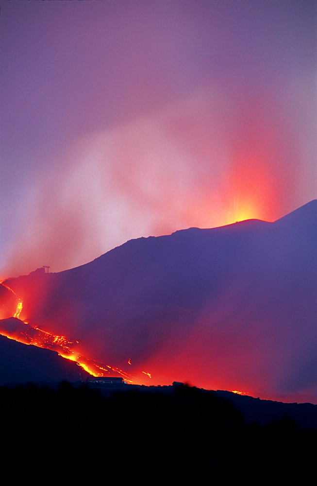 Lava flow from the Piano del Lago cone destroying the cable car above Rifugio Sapienza on the south flank of Mount Etna during the 2001 eruptions, Sicily, Italy, Europe