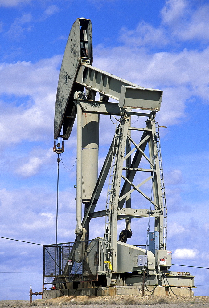 Working pumpjack near Rangely in the desert plateau oilfields of the Rio Blanco area in the far north west. War needs stimulated drilling here in the 1940s, north west, Colorado, Utah, United States of America (USA), North America