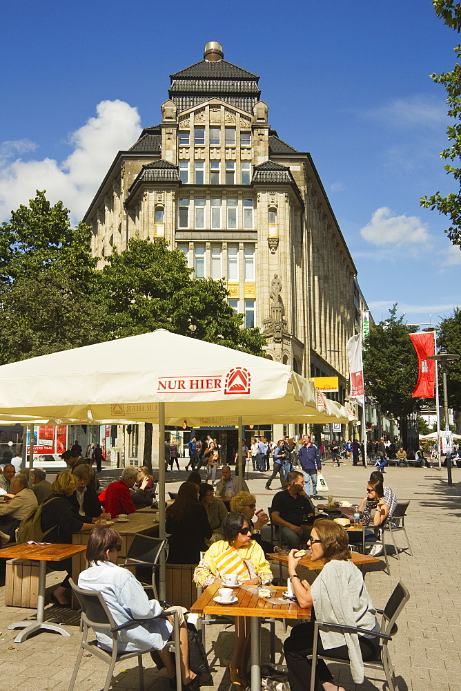 People outside cafe on Barkhof where Spitalerstrasse and Moenckebergstrasse meet in the city's shopping heart, Hamburg, Germany, Europe