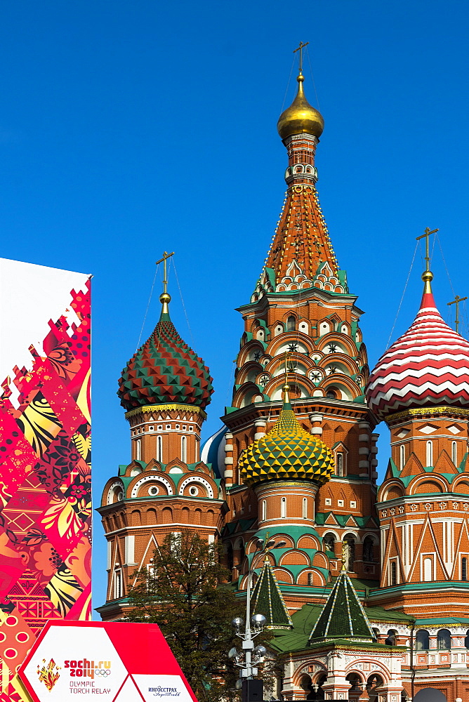 Torch Relay stand for Sochi Winter Olympics 2014, with onion domes of St. Basil's Cathedral beyond, Red Square, Moscow, Russia, Europe