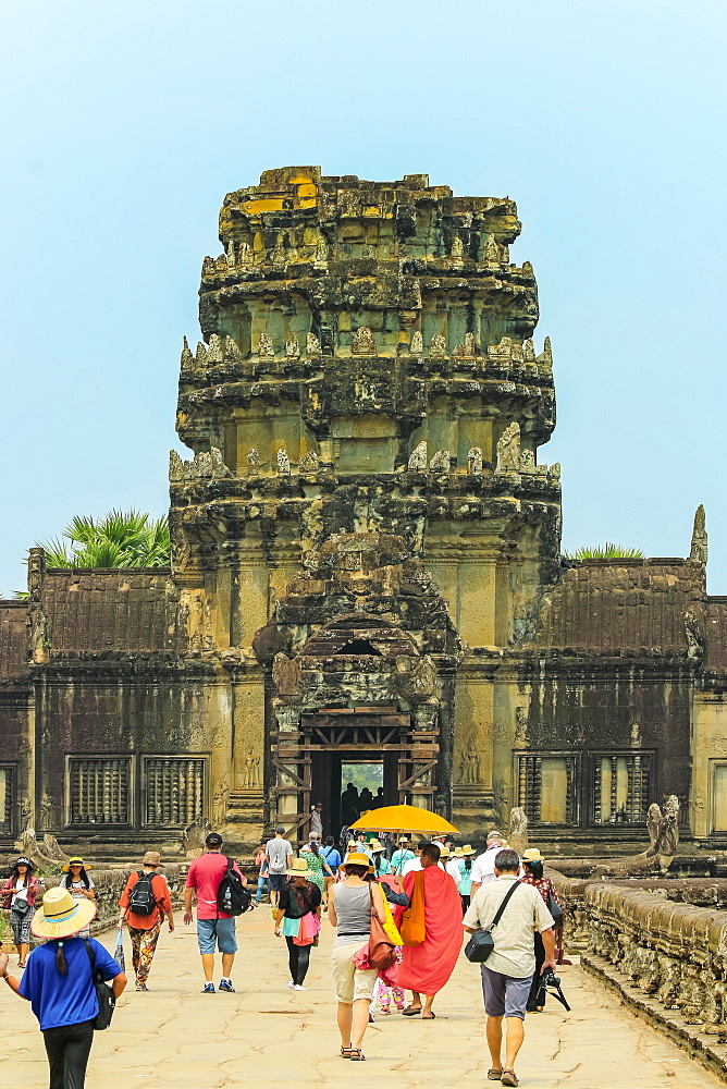 Visitors on the sandstone causeway exit from the famous Angkor Wat temple complex, Angkor, UNESCO World Heritage Site, Siem Reap, Cambodia, Indochina, Southeast Asia, Asia