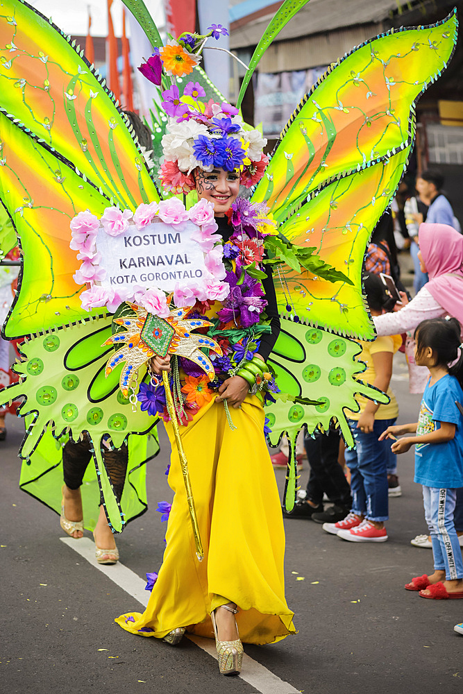 Girl in elaborate butterfly costume at the annual Tomohon International Flower Festival parade, Tomohon, North Sulawesi, Sulawesi, Indonesia, Southeast Asia, Asia