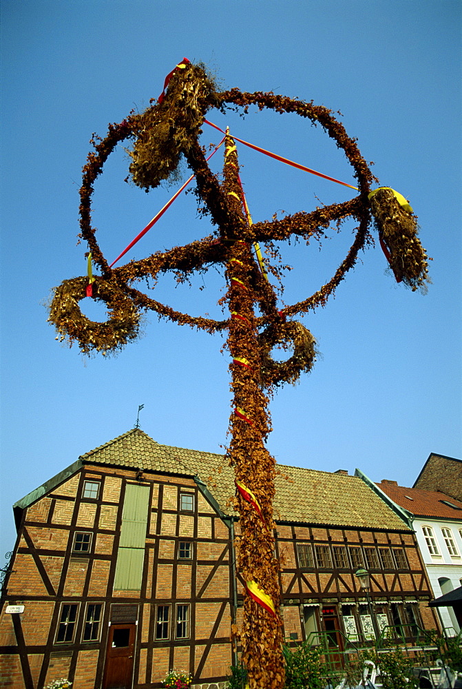 Maypole and half timbered houses in 16th century Lilla Torget in the historic port of Malmo, southern tip of Sweden, Scandinavia, Europe